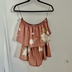 Strapless blush pink romper with floral pattern